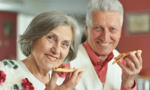 Elderly Couple Eating Together.